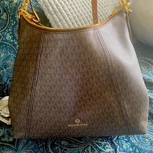 New Michael Kors brown signature style shoulder handbag.